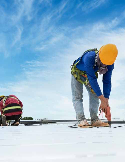 Man working on commercial roof