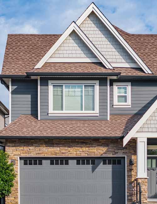 Beige roof on residential home.