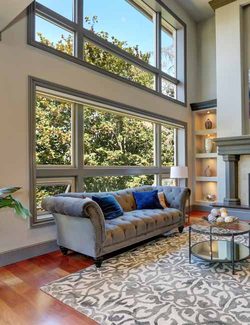 Large living room window with sofa